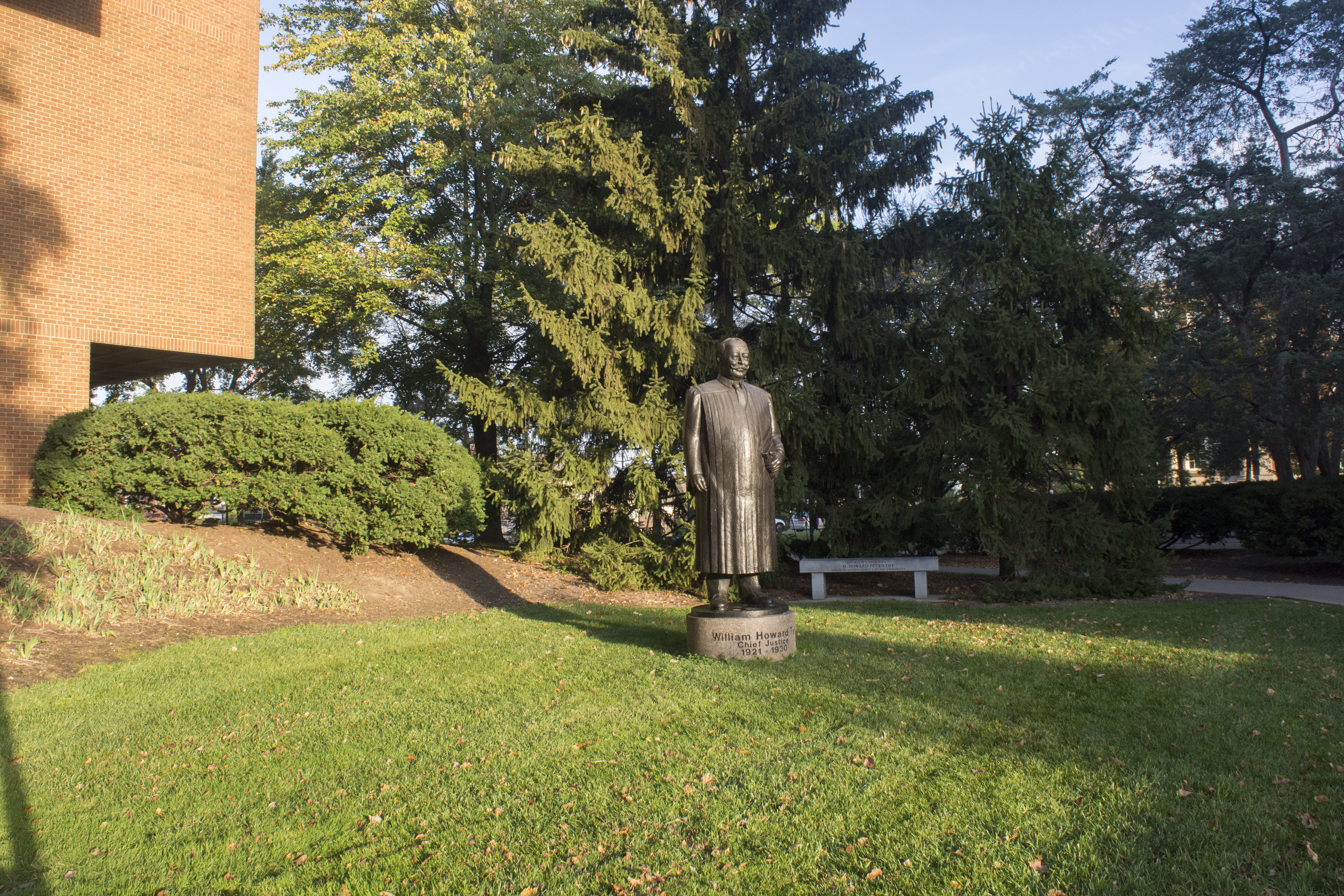 A statue of William Howard Taft near the entrance to the College of Law building.